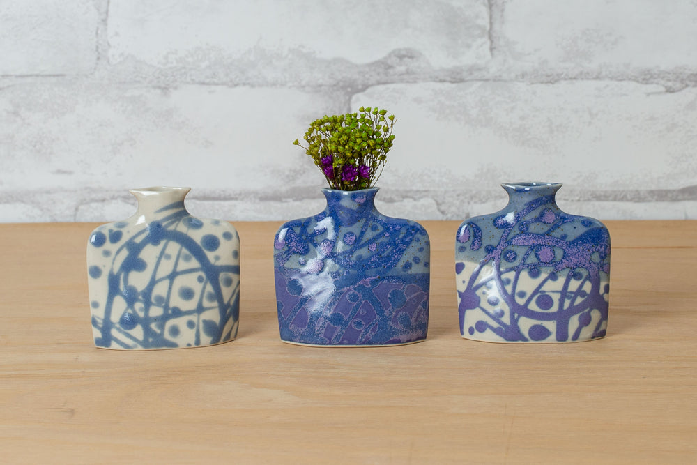 A collection of small blue and white vases.